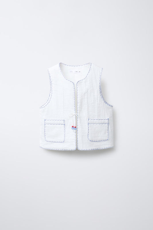 Chaleco acolchado bordado contraste