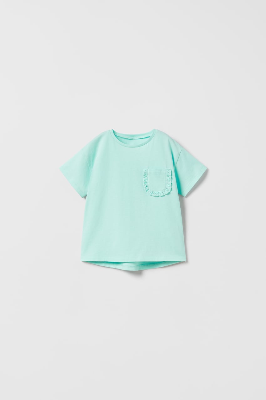 Polera bolsillo turquesa