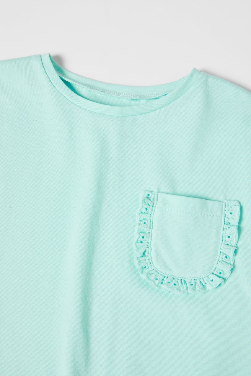 Polera bolsillo turquesa