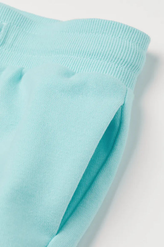 Short turquesa claro