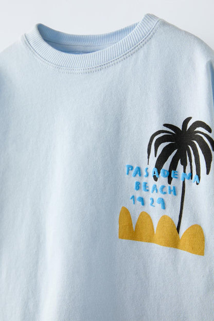 Polera palmeras y olas